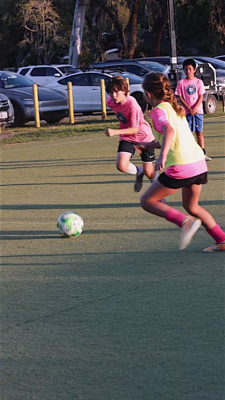 Two players chasing the ball